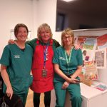 Health professionals standing together at a networking event.