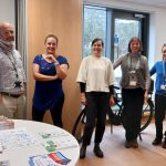 People standing together at a networking event.